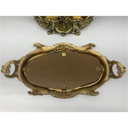 Ornate brass centrepiece, with twin handled vase upon a mirrored base, with floral and scrolling decoration, H23cm 