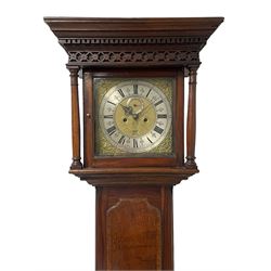 John Watts of Canterbury - early 18th century 8-day oak longcase clock, with a flat topped hood, broad cornice, dentil moulding and blind fret beneath, baluster turned pilasters with wooden capitals flanking the square hood door, trunk with recessed beaded edge and a long ogee topped door with crossbanding, plinth with applied skirting, square brass dial with matching steel hands, cast spandrels and a matted and engraved centre, date aperture, seconds ring and ring turned winding apertures, silvered chapter ring with Roman numerals, five minute Arabics, minute and quarter hour tracks, five pillar movement with a recoil anchor escapement and inside countwheel strike, sounding the hours on a bell. With weights and pendulum.