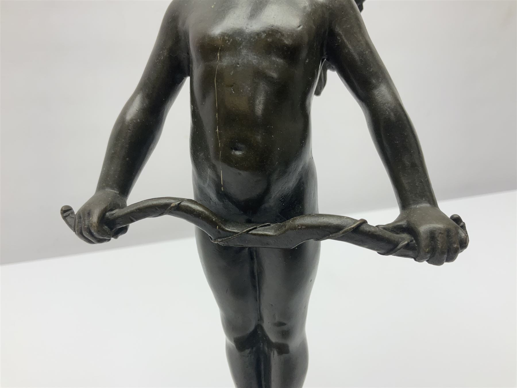 After Moreau, bronzed figure modeled as an angel holding a bow, with foundry mark upon socle base, H30cm