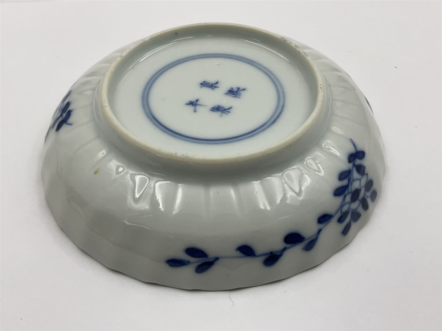 18th century Chinese blue and white Kangxi teacup and saucer, decorated with dancing figures, four character Kangxi mark beneath, saucer D10cm
