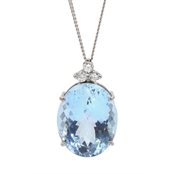 18ct white gold oval aquamarine and three stone diamond pendant, aquamarine approx 17.00 carat, on a silver chain stamped 925