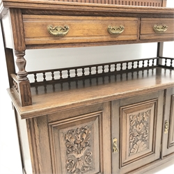 Edwardian oak sideboard, raised shaped back, two drawers above galleried shelf, three carved cupboard doors, W138cm, H155cm, D51cm
