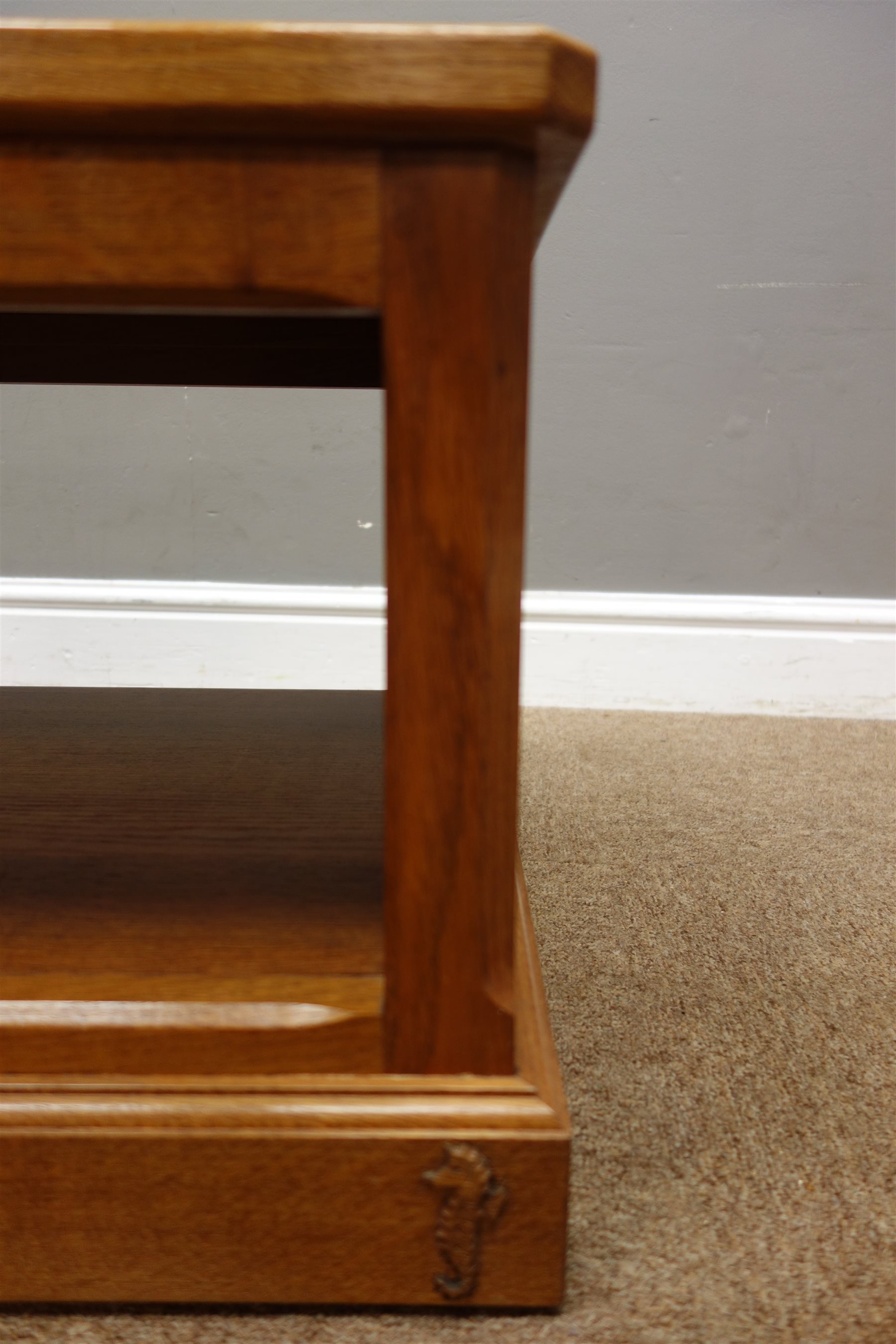 'Seahorse' oak stand/coffee table, panelled sides, plinth base, on castors, by Shaw and Michael