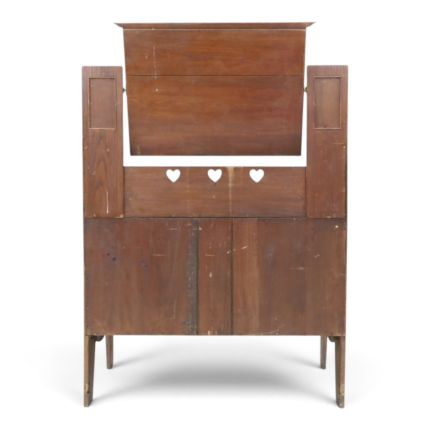 Shapland & Petter - oak mirrored dressing chest, tilted mirror flanked by tulip carved supports, shaped shelves with heart cut outs, above two short over one long drawers, with brass handles and stamped S & P on the locks, raised on shaped supports