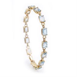 9ct gold Swiss blue topaz bracelet, set with thirteen rectangular cut topaz's, hallmarked
