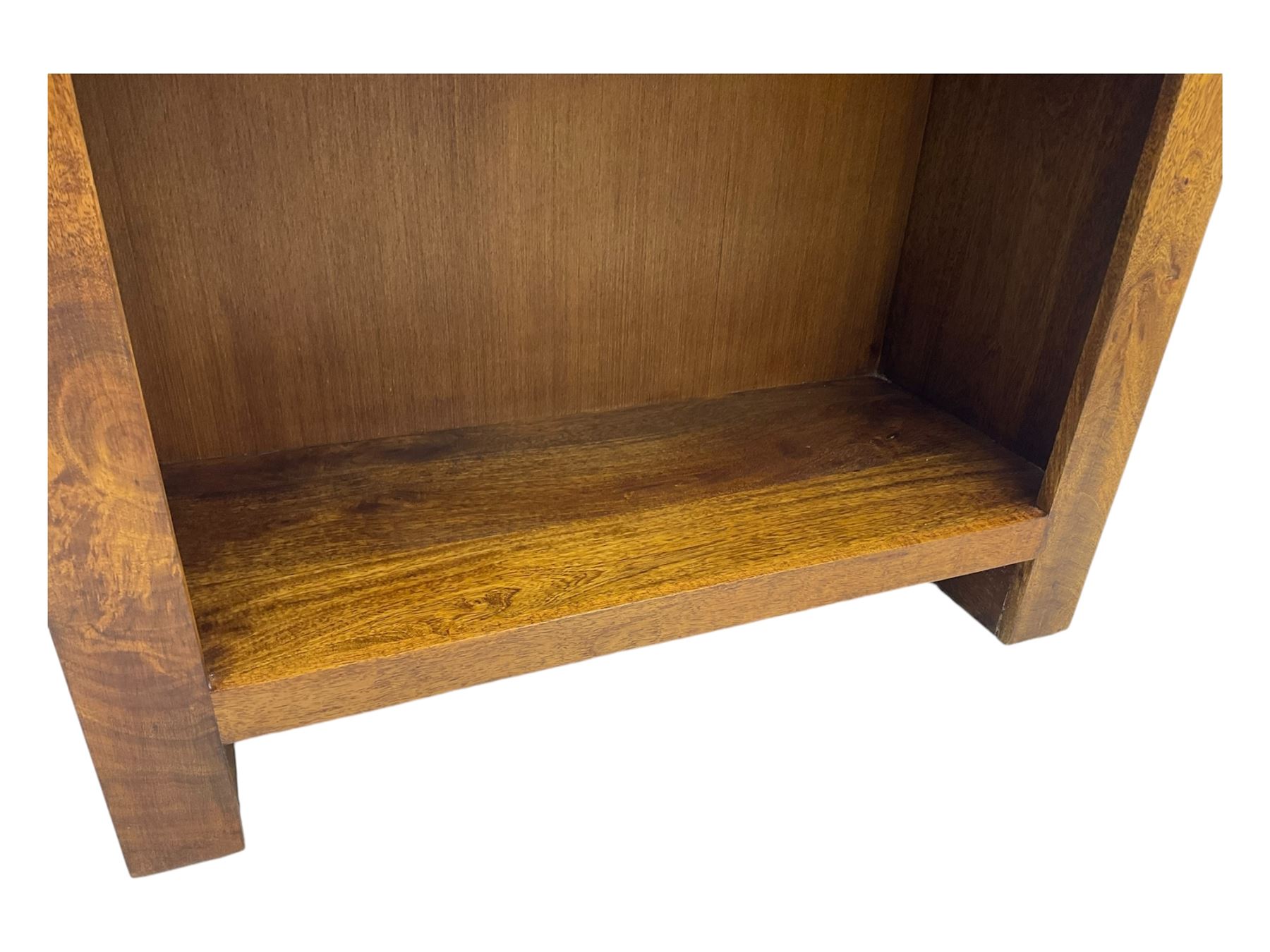 Contemporary Dakota mango wood open bookcase, rectangular form with four fixed open shelves, raised on stile supports