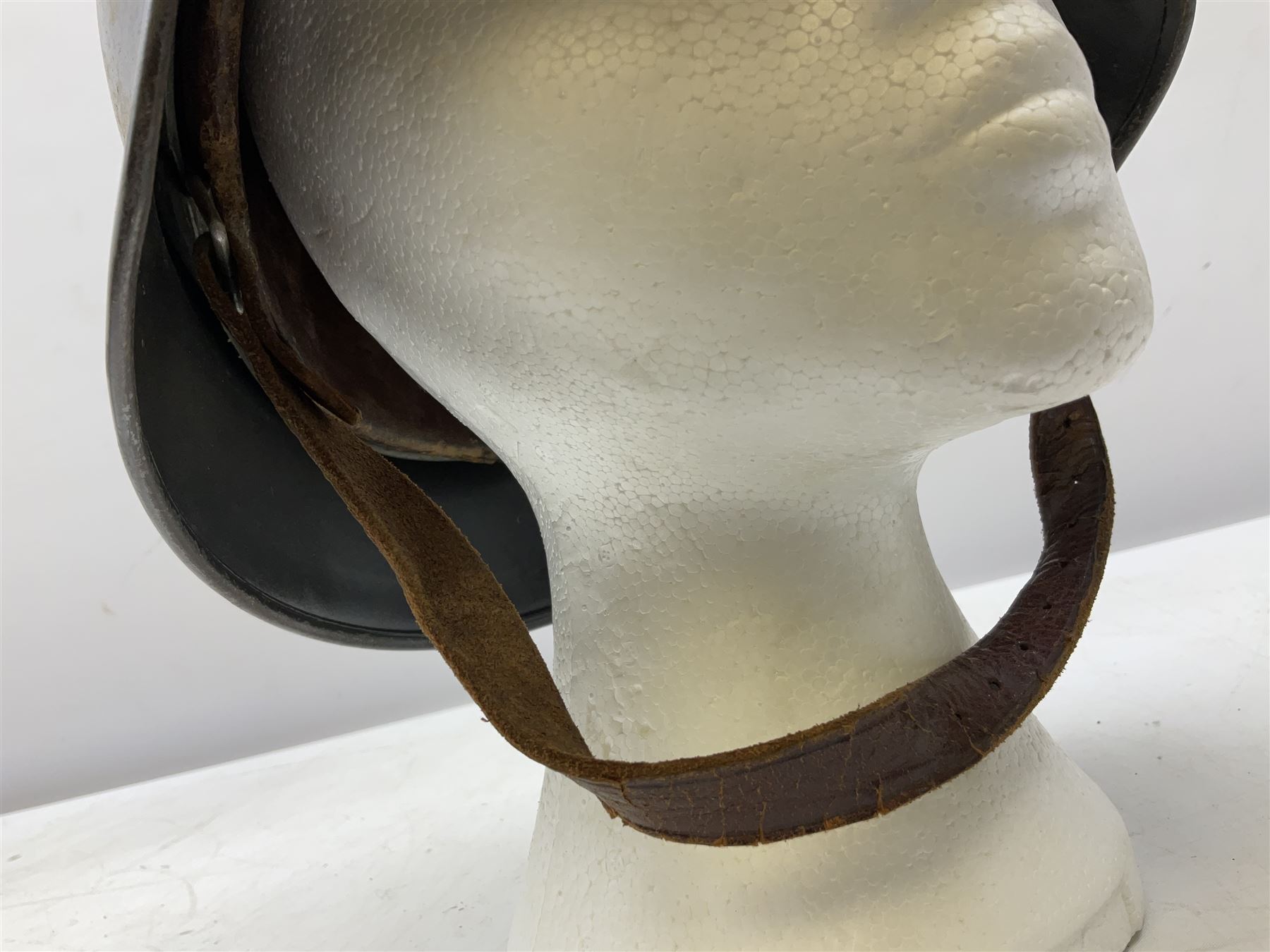 WW2 German steel helmet painted in undecaled Luftwaffe bluey grey with leather liner and chin strap stamped '58', the skirt impressed '1250'