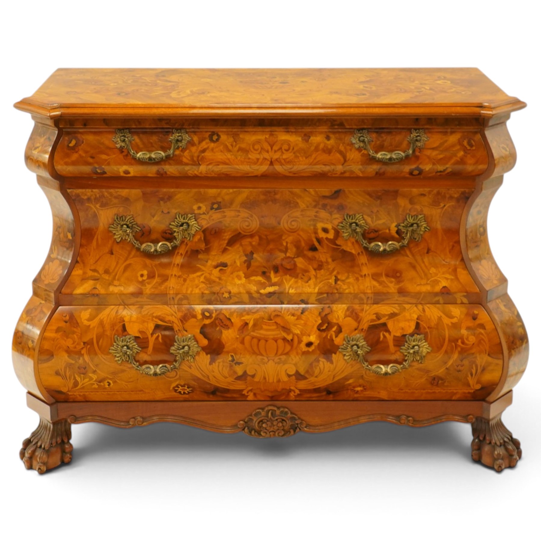 Colombo Mobili - Italian walnut and floral marquetry bombé commode chest, rectangular top with canted eared corners inlaid with urn motif and trailing scrolling foliage, fitted with three long graduating drawers with gilt metal handles, profusely inlaid with scrolling acanthus leaves interspersed with urns and cartouches, on large carved ball-and-claw feet