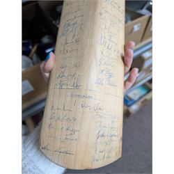 Two signed cricket bats, with signatures including Colin Cowdrey