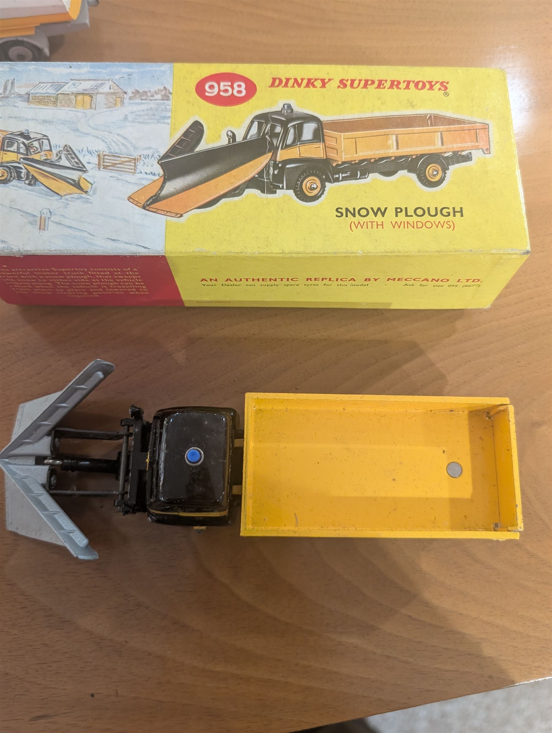 Three Dinky Toys diecast vehicles, comprising Field Marshall Tractor no. 301, Shell BP Fuel Tanker no. 944 and Snow Plough no. 958, all boxed