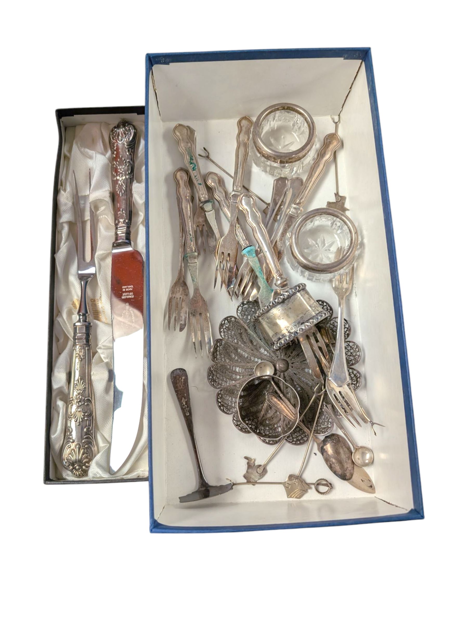 Group of silver, including set of six cake forks, two napkin rings, set of six silver-handled cake forks, silver-handled carving set, etc 