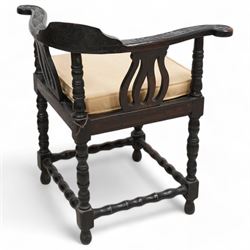 Victorian carved oak corner chair, shaped arms carved with trailing leafy branches, pierced splats over panelled seat, on bobbin turned supports and stretcher