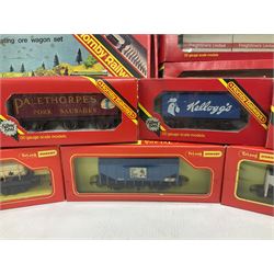 Hornby/Tri-Ang ‘00’ gauge - fifteen goods wagons to include freightliners with containers, ore wagons, closed vans etc; together with R404 Operating ore wagon set; all boxed (16) 