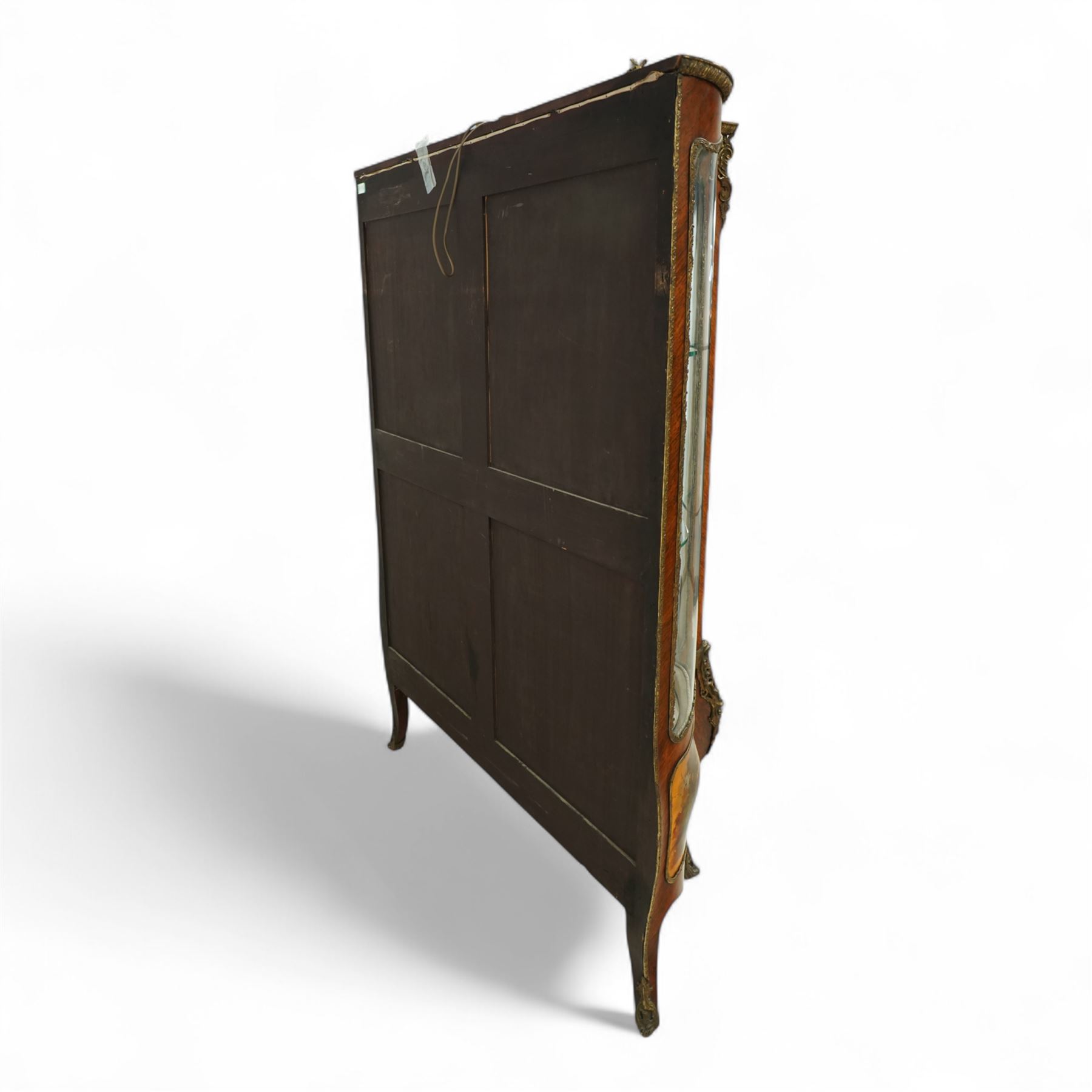 Louis XV revival kingwood Vernis-Martin serpentine fronted vitrine cabinet, arched top with gilt brass foliate mounts, glazed door with two shelves above three painted panels, depicting pastoral scenes, supported on out-swept cabriole legs with gilt brass mounts and sabots.