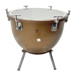 Timpani drum with coppered finish to the bowl, marked 'BS 3499' underneath and three adjustable tubular legs; bears Premier label D67cm