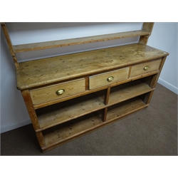  19th century pine dresser, three shelf plate rack, three drawers, square supports joined by an undertier with two shelves, plinth base, W188cm, H221cm, D55cm  