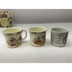 Royal Doulton Bunnykins nursery set in box and two cups, together with two Wedgwood Peter Rabbit mugs and Royal Staffordshire Noddy money box and cup (7)
