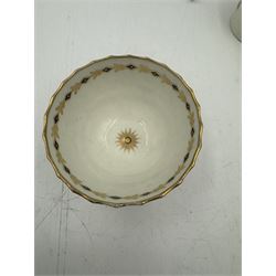 18th century Caughley blue and white sparrow jug, decorated in the Mother and Child pattern, circa 1780-1790, with underglaze C mark beneath, H9cm, together with a Worcester coffee cup, circa 1785 painted with floral sprays in underglaze blue and gilt, with crescent mark beneath, and a Caughley trio of tea cup, tea bowl and saucer, each of moulded wrythen fluted form and decorated with gilt and blue sprigs and bands, each with crescent mark beneath, (5)