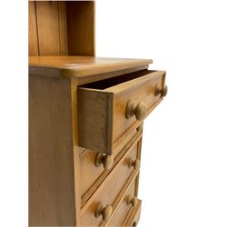 Solid pine dresser, fitted with four drawers and two tier plate rack