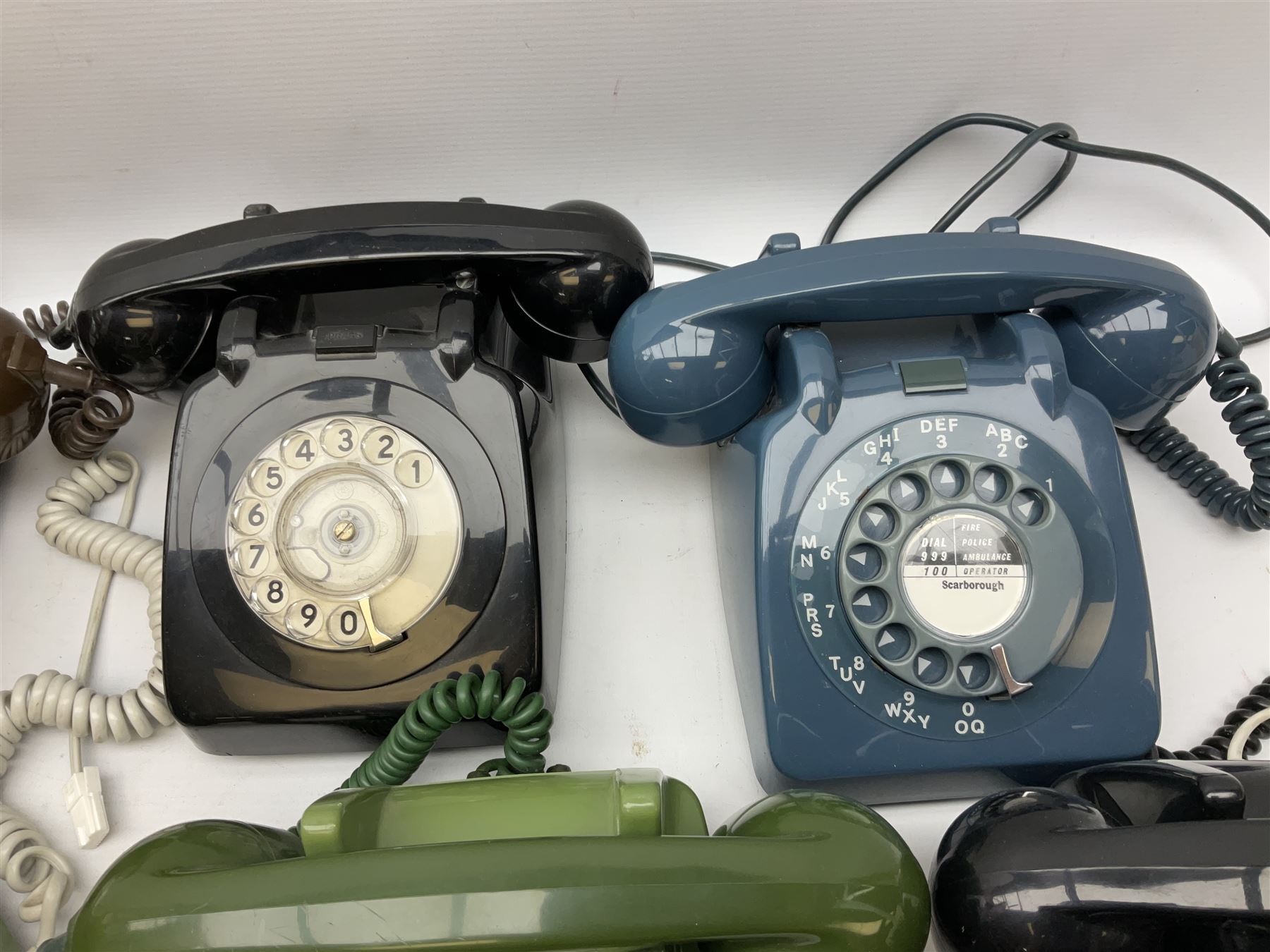 Collection of six vintage telephones, including a trimphones telephone