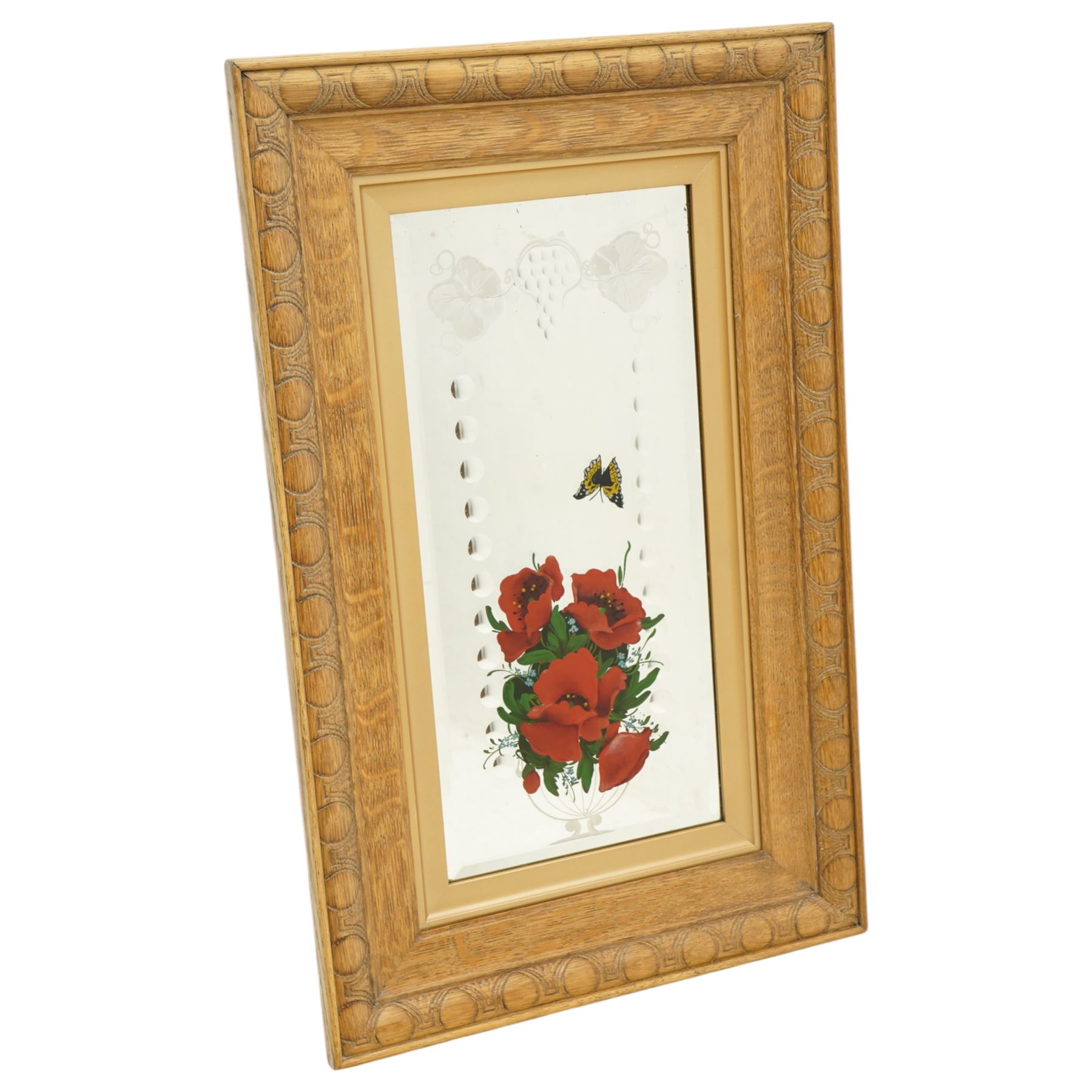 Set of eight early/mid 20th century oak framed 'Gypsy' mirrors, each of rectangular form, the mirror plates decorated with acid etched and cut fruiting vines and reverse painted flowering urns and butterflies, overall 82.5cm x 52cm
