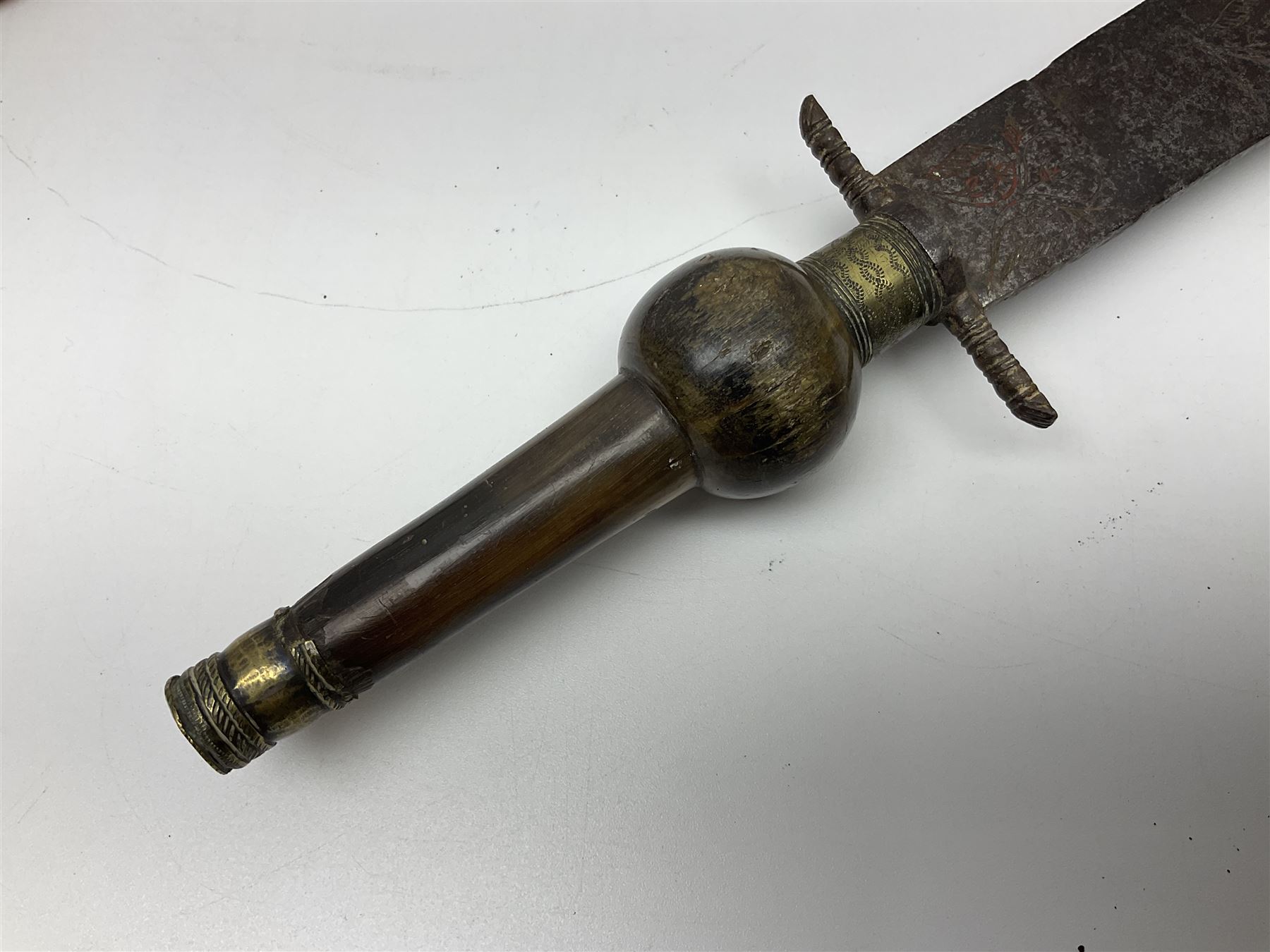 19th century continental folding knife with 15.5cm single edged blade, the pierced brass and iron handle with remains of horn grips L21.5cm overall closed; turned horn handled knife with foliate engraved blade; battlefield relic German 1884/98 knife bayonet; iron spear head; leather covered swagger stick; and two-piece gun cleaning rod