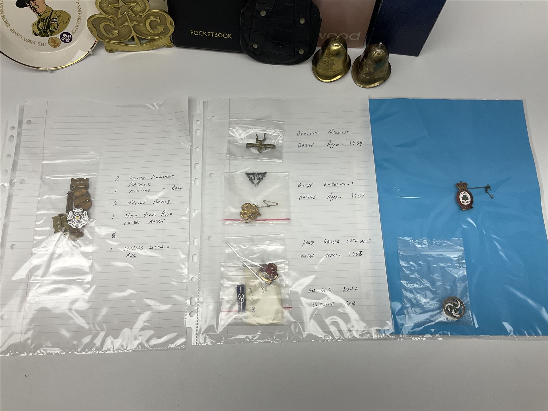 Bradford City Police pre-1974 helmet plate, buttons and Police Box key with finders fob; post-1974 West Yorkshire Police cap badge; Leeds City Police Pockebook with Bradford Notebook; quantity of Girl Guide Memorabilia including boxed Wedgwood limited edition jasperware 1970 Diamond Jubilee loving cup; brass banner pole finial; various metal, silver and enamel badges and paperwork etc 1950s - 1980s all relating to Maureen Margaret Jowett (AKA Jewitt)