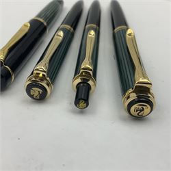 Pelikan Souveran 140 fountain pen, the green and black striped barrel with gold plated beak shaped clip and bands, with gold nib stamped 14C-585, together with matching twist ballpoint pen, push ballpoint pen and propelling pencil, largest approx L13.5cm (4)