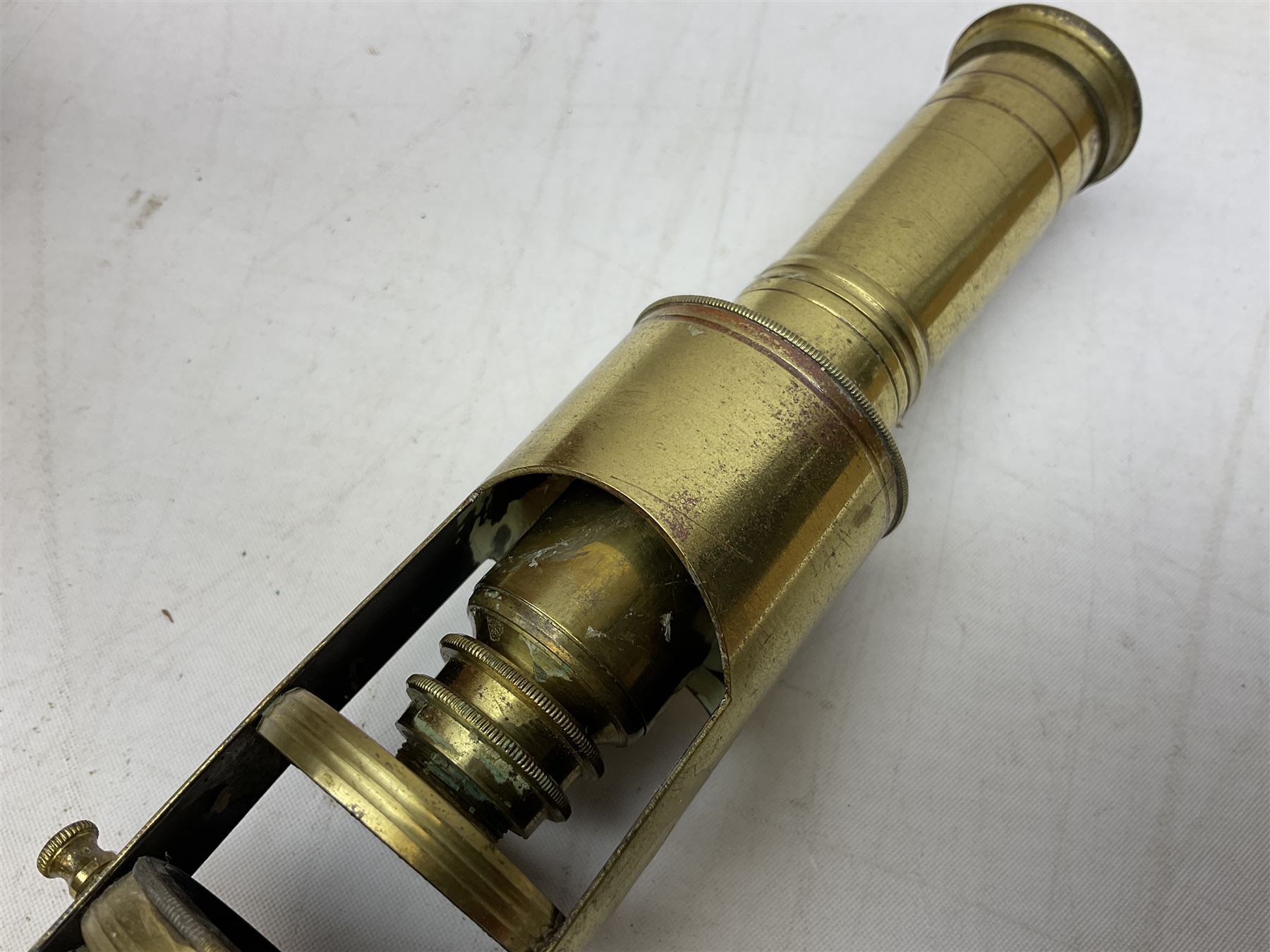  Brass field microscope, together with a cased microscope and twenty five microscope slides