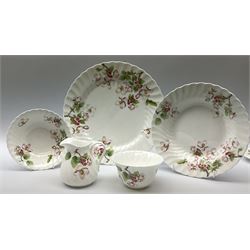 Wedgwood Apple Blossom pattern dinner and tea wares, comprising six dinner plates, six side plates, six bowls, nine smaller bowls, six tea cups and six saucers, milk jug and open sucrier. 