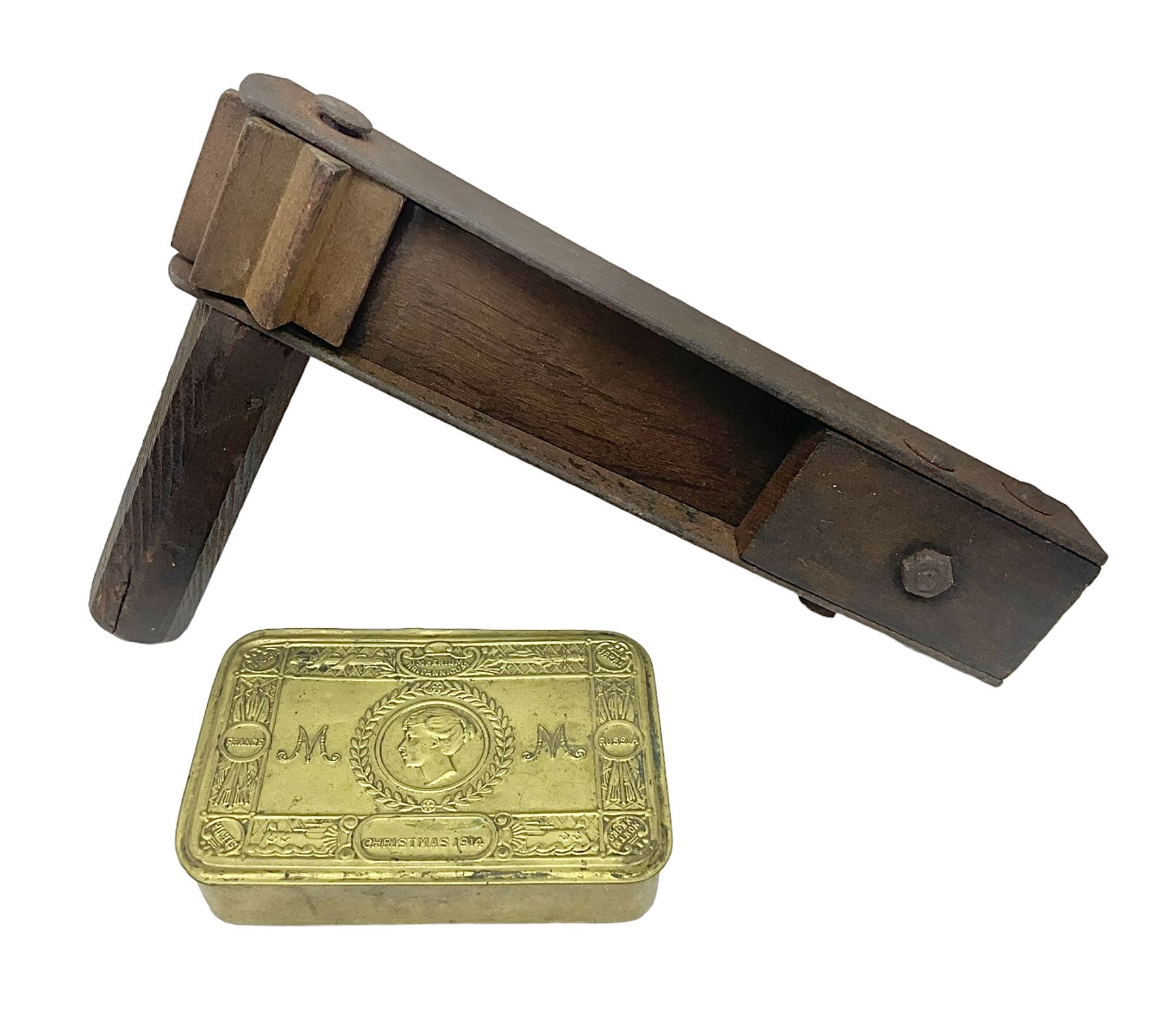 WWI Princess Mary Christmas 1914 brass gift tin containing imitation copies of packets of tobacco, cigarettes and greeting card; together with a WWI oak and steel trench gas rattle marked A. & N.C.S. (Army & Navy Cooperative Society) and broad arrow above '79' above 'G'