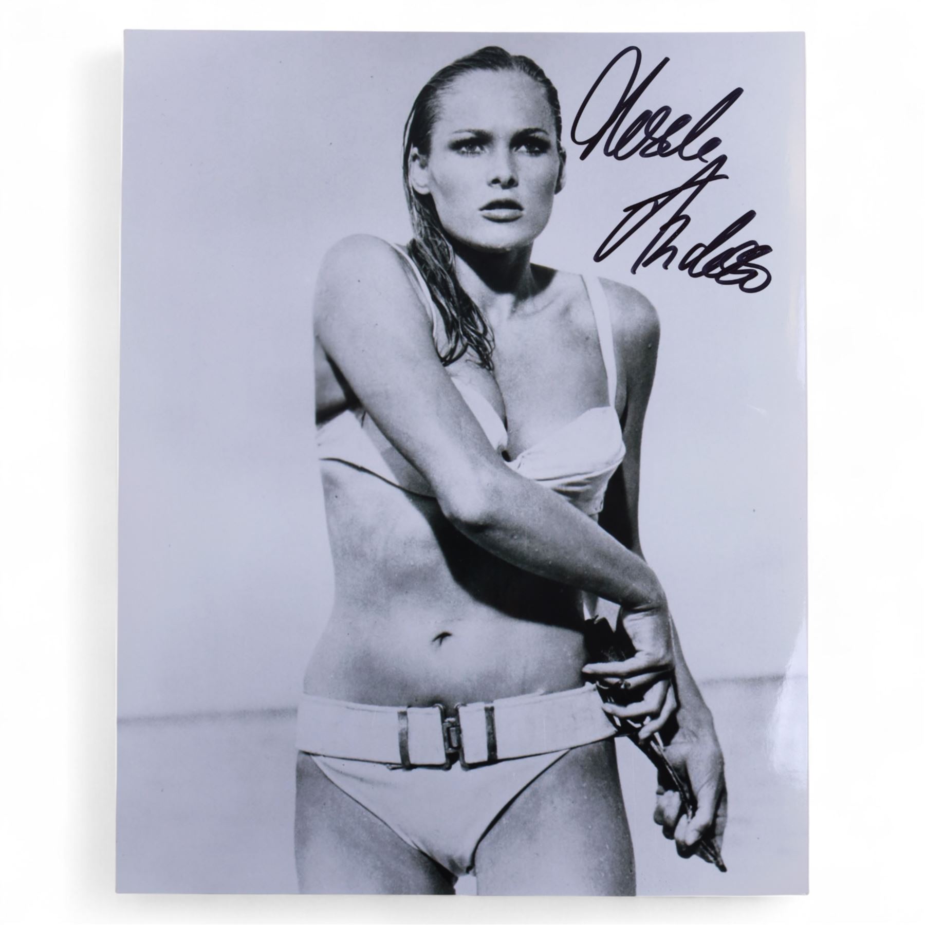 Eight James Bond signed 10 x 8