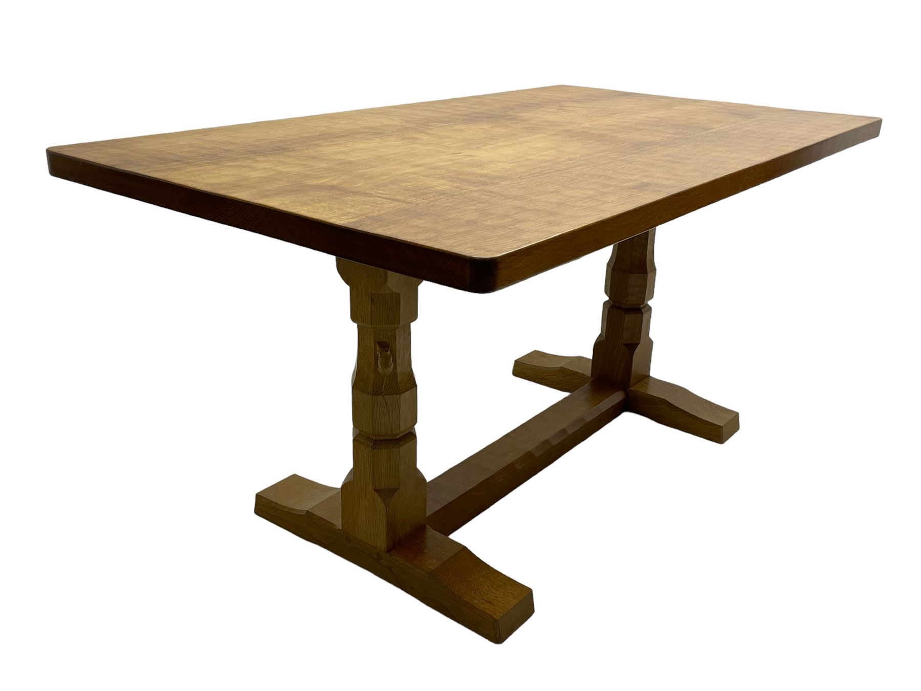 Mouseman - oak dining table, adzed rectangular top on twin octagonal pillar supports, sledge feet united by floor stretcher, by the workshop of Robert Thompson, Kilburn 