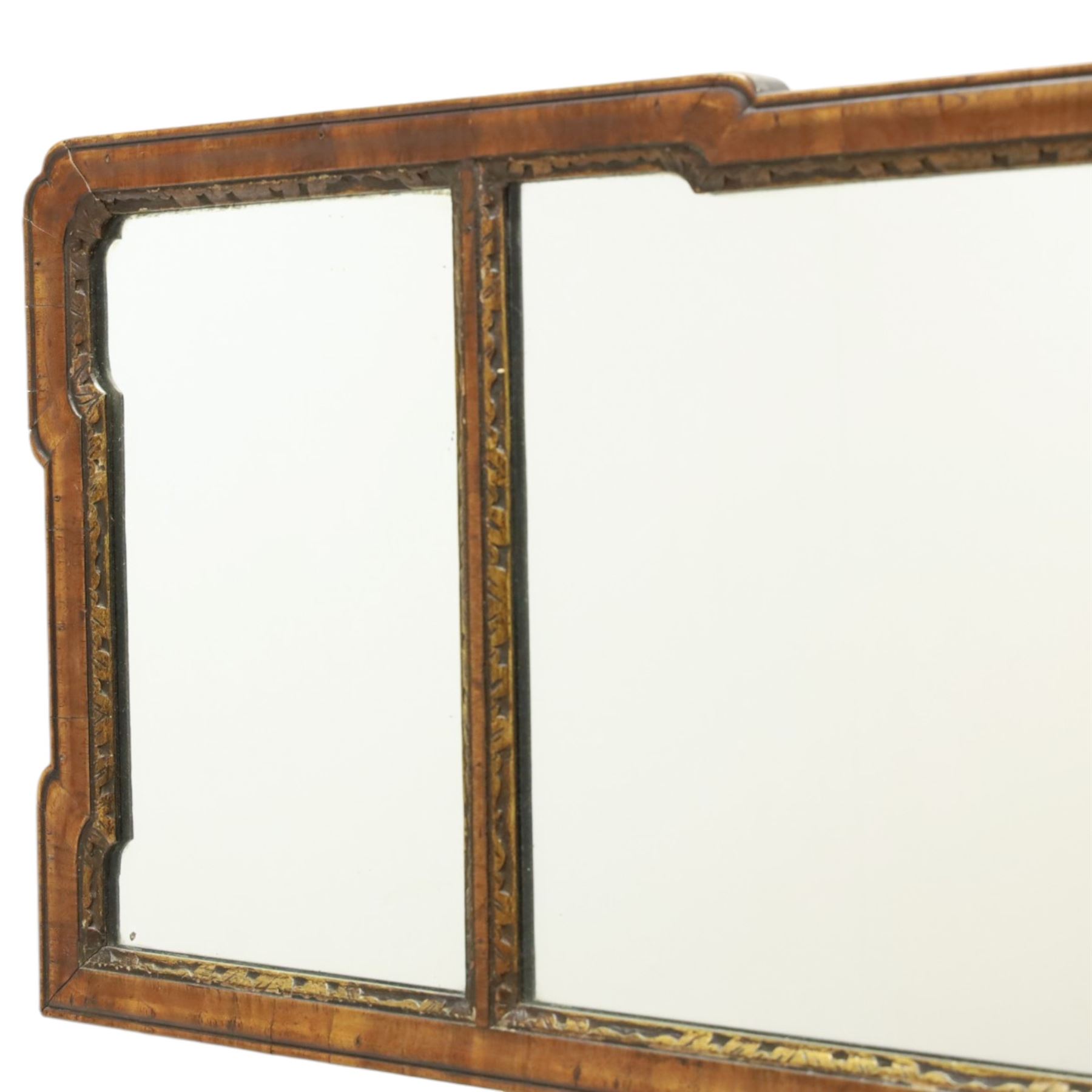 George III tripartite walnut overmantel mirror, shaped moulded frame with foliate carved gilded inner slip, enclosing an original mercury mirror plate, later applied back 