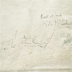 Signed saddle cloth, previously on display in the Mount Royale Hotel, York, autographed by various visiting jockeys and racing related television persons, to include Pat Eddery, Brough Scott, John McCririck, Peter O Sullivan, Willie Carson and others, frame 85cm x 69cm 