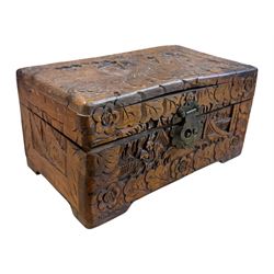 Approximately 115 grams of Great British pre-1947 silver coins, and further pre-decimal coins, housed in a miniature carved camphor wood chest