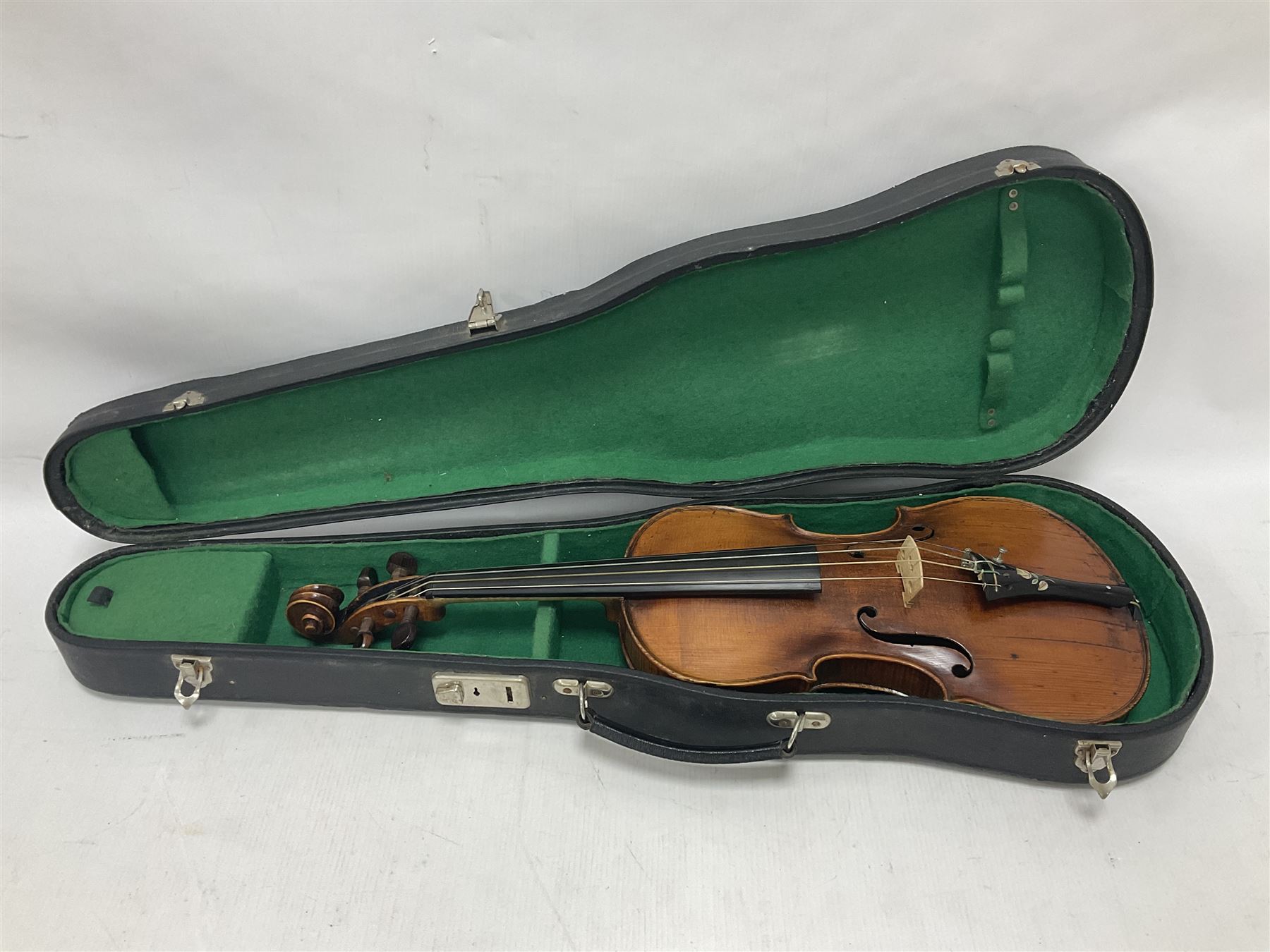 19th century full sized violin in a later hard case, decorative mother of pearl inlay to the tail piece Overall length 60cm No bow