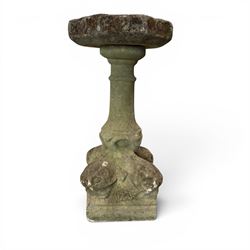 19th century weathered sandstone birdbath, the octagonal canted dished top raised on a rin...