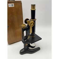 Brass and black enamelled monocular microscope by Bausch & Lomb Rochester New York No.144787 on pitchfork base H32cm; in fitted mahogany box with quantity of unused glass slides