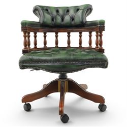 Captains swivel desk chair upholstered in buttoned green leather, five point star base raised on castors