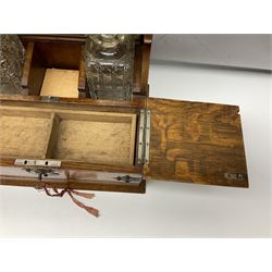Victorian oak tantalus, mirrored high-back with recess for housing the decanters, behind a hinged box, with cribbage board to the concealed drawer below, marked Barman, London, H33cm, L37cm
