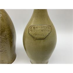  19th century salt glazed stoneware gin bottle impressed John Shaw, Red Lion Vaults, Whitefriargate, Hull of bulbous oval form H27cm and another with impressed label for J. Christie Mytongate Hull (2)  