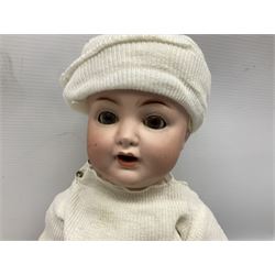 Carl Harmus Germany bisque head doll with applied hair, sleeping eyes, open mouth with teeth and composition body with jointed limbs; marked 'Harmus 313.4/0 Germany' H38cm; and Alt, Beck & Gottschalk Germany bisque head doll with applied hair, fixed eyes, open mouth with tongue and composition body with jointed limbs H44cm (2)