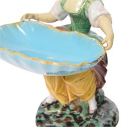 Pair of Minton majolica Hogarth figures, modelled as a seated boy and girl, on tree stumps, both holding sweetmeat dishes, with impressed marks beneath, H18cm 