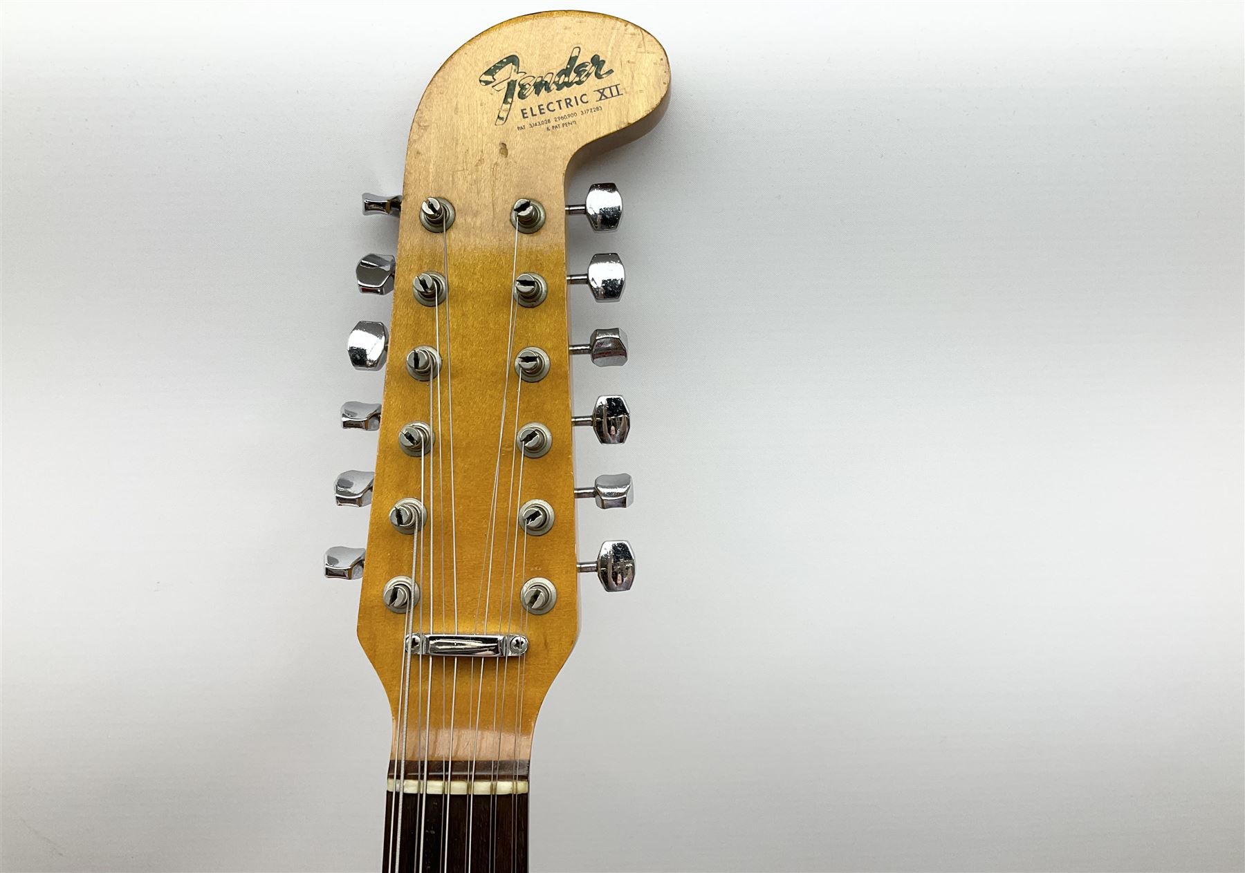 Fender three-tone Sunburst 12-string electric guitar c1965/6 Fullerton USA, with alder body and maple neck, the Indian rosewood fretboard with twenty-one frets and pearloid dot markers, fender electric XII bridge, F-stamp tuners (non-original), two split single coil pick-ups, master volume and tone and four-way switch, serial no.129730, L108cm; in original Fender case bearing label for Rivington Guitars New York with copy of original invoice; together with GuitarKes set-up and service certificate dated October 2021
