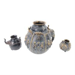 Large Thai vase decorated with relief figures and elephants, together with two smaller examples