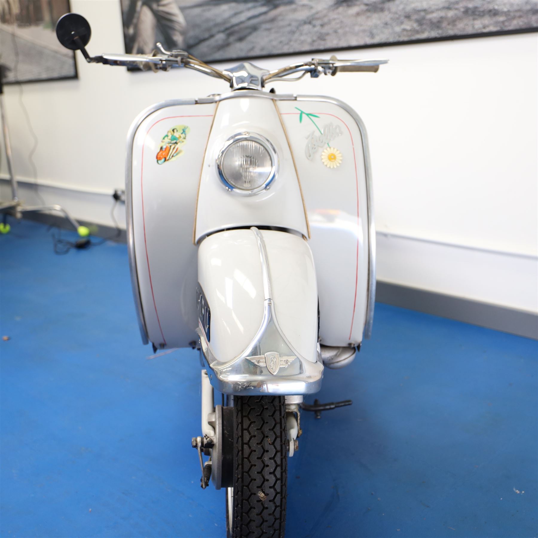 1957 Zündapp Bella R154 Scooter

• Registration: 150 KPU
• Year: 1957
• Model: Bella R154
• Engine: 150cc two-stroke single-cylinder petrol
• Transmission: Four-speed manual
• Odometer reading: 1,727 miles
• Colour: Ivory
• Seating: Dual seat
• V5C: Present
• Original registration book: Present
• Keys: 1

A characterful 1957 Zündapp Bella R154 scooter, finished in ivory with a contrasting brown dual seat and displaying an odometer reading of 1,727 miles.

The Bella R154 formed part of Zündapp’s distinctive range of German touring scooters, combining a 150cc air-cooled two-stroke engine with four-speed transmission, large wheels and substantial pressed-steel bodywork. This example retains its enclosed front apron, central headlamp, chrome handlebars, brightwork, period VDO speedometer and decorative Bella badging.

An operation and maintenance manual is include and accompanied by its V5C and original registration book from 1957.

This vehicle forms part of the Estate of the Late John Sills and is offered for sale by the Executors, confirming a genuine reason for sale.