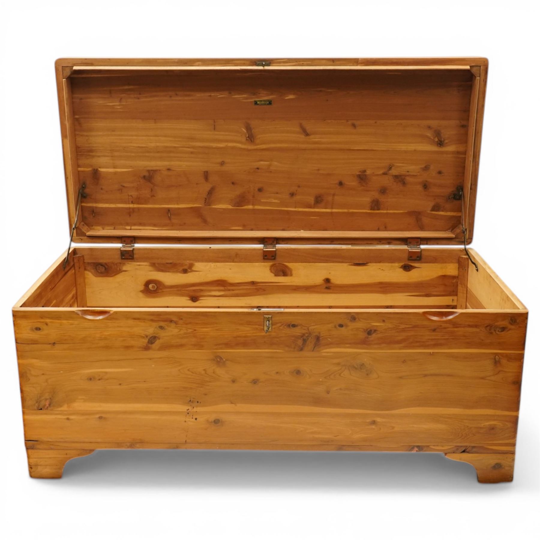 20th century American pine blanket chest, raised on bracket feet, makers label to interior