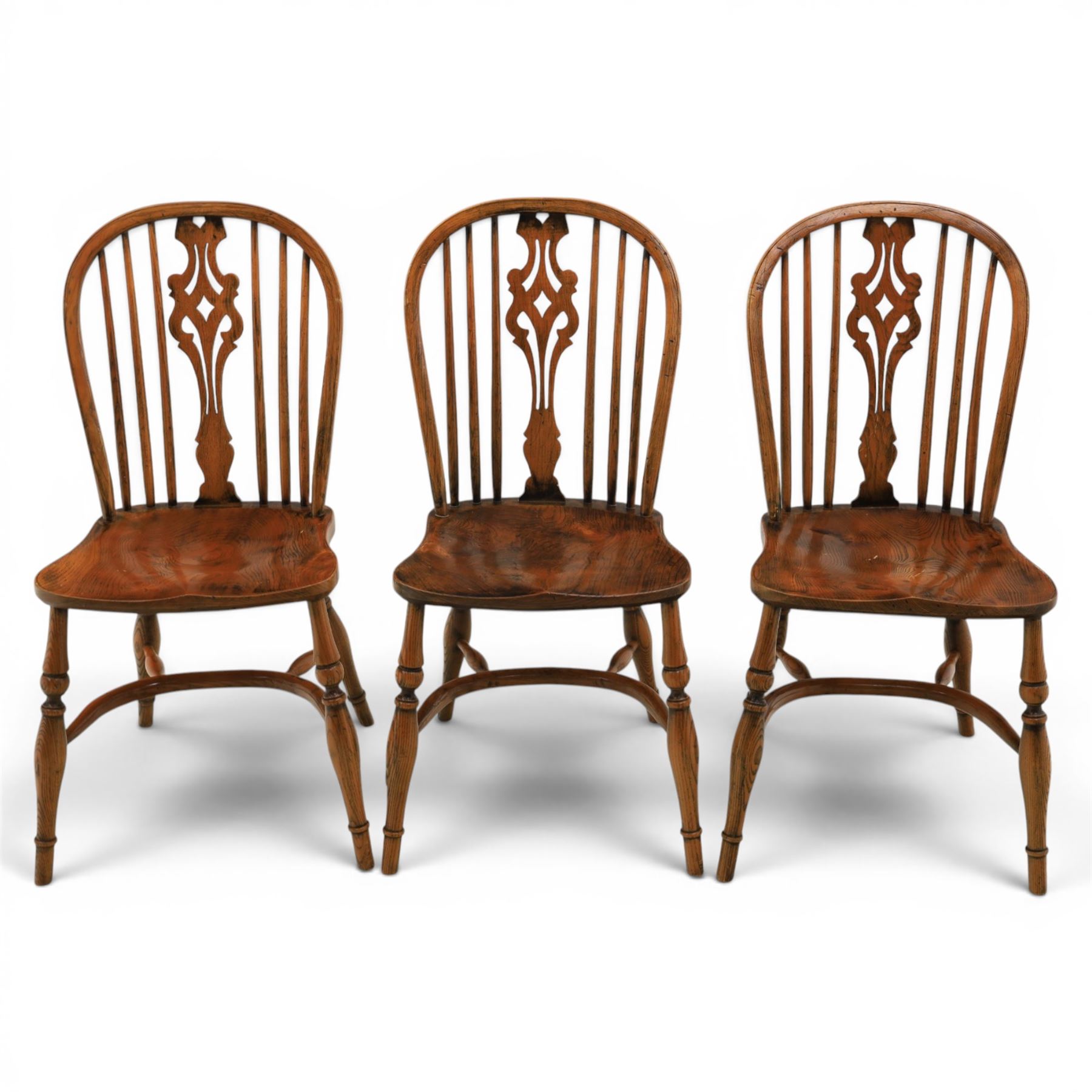 Set of six elm Windsor chairs, saddle seats with crinoline stretchers