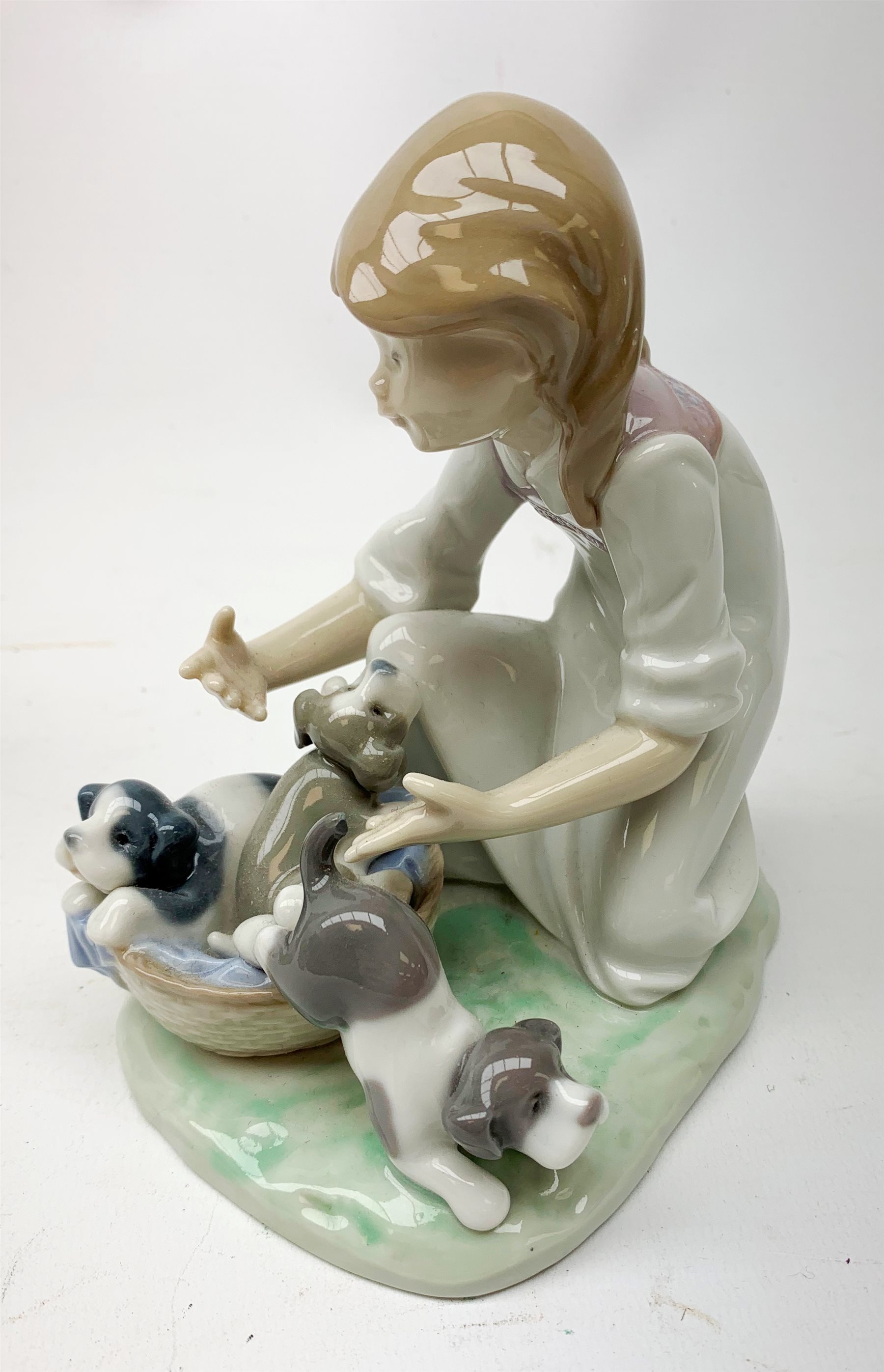 A Lladro figurine, 'This one's mine' Model 5376, H19cm, together with